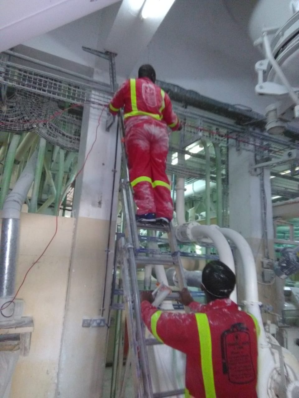 Zambani Rock Fire technician installing a fire alarm system on-site in Kenya