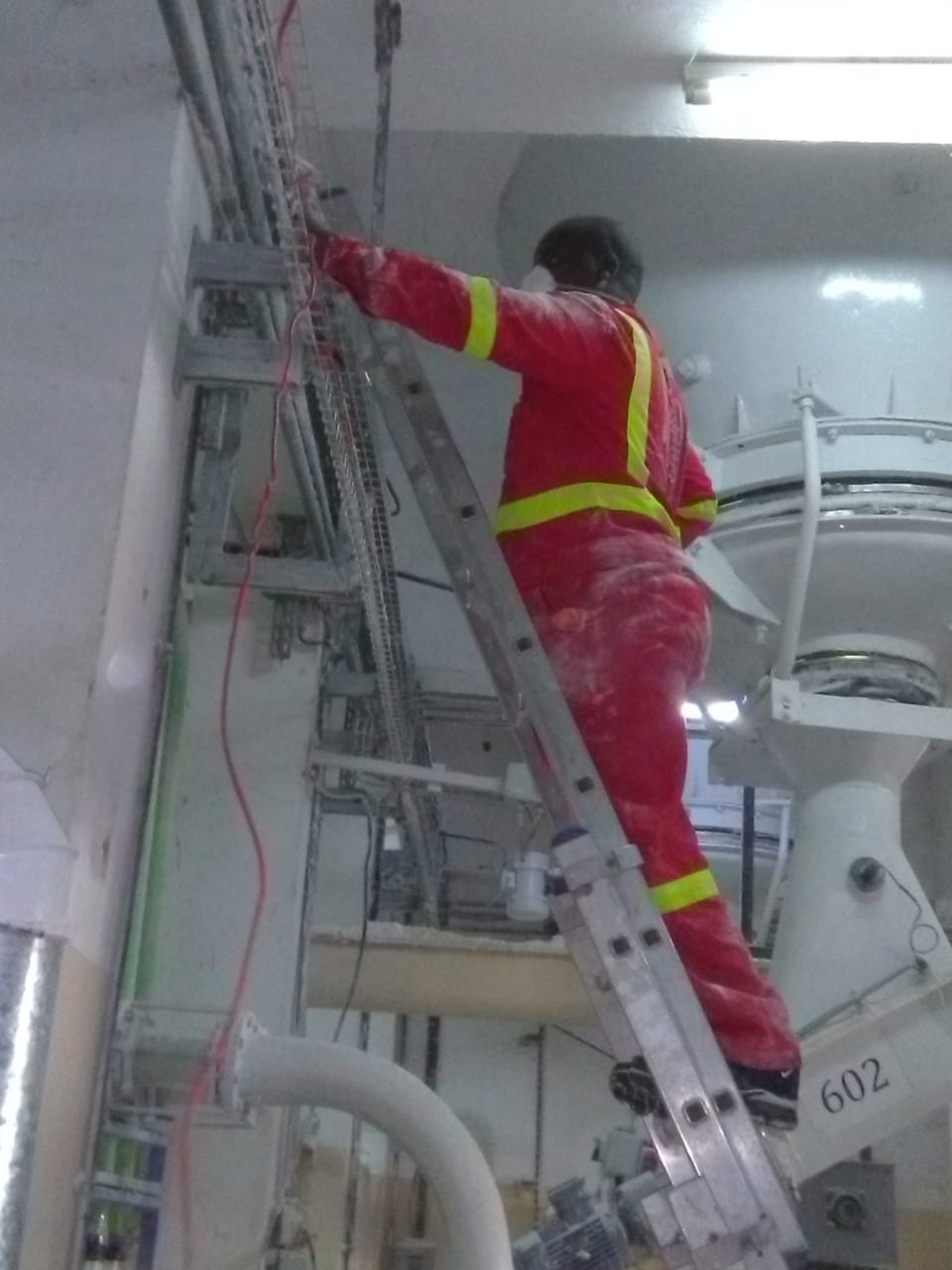 Zambani Rock Fire technician running fire alarm wiring at a client facility in Kenya